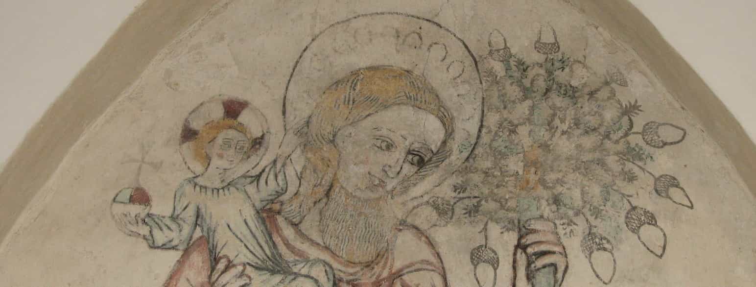 I Egebjerg Kirke i Odsherred er der et stort kalkmaleri af Sankt Kristoffer med Jesus på armen.